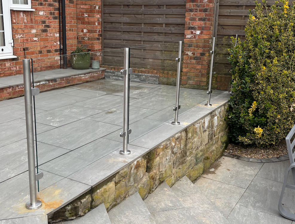 Close view of stainless steel post and glass balustrade system