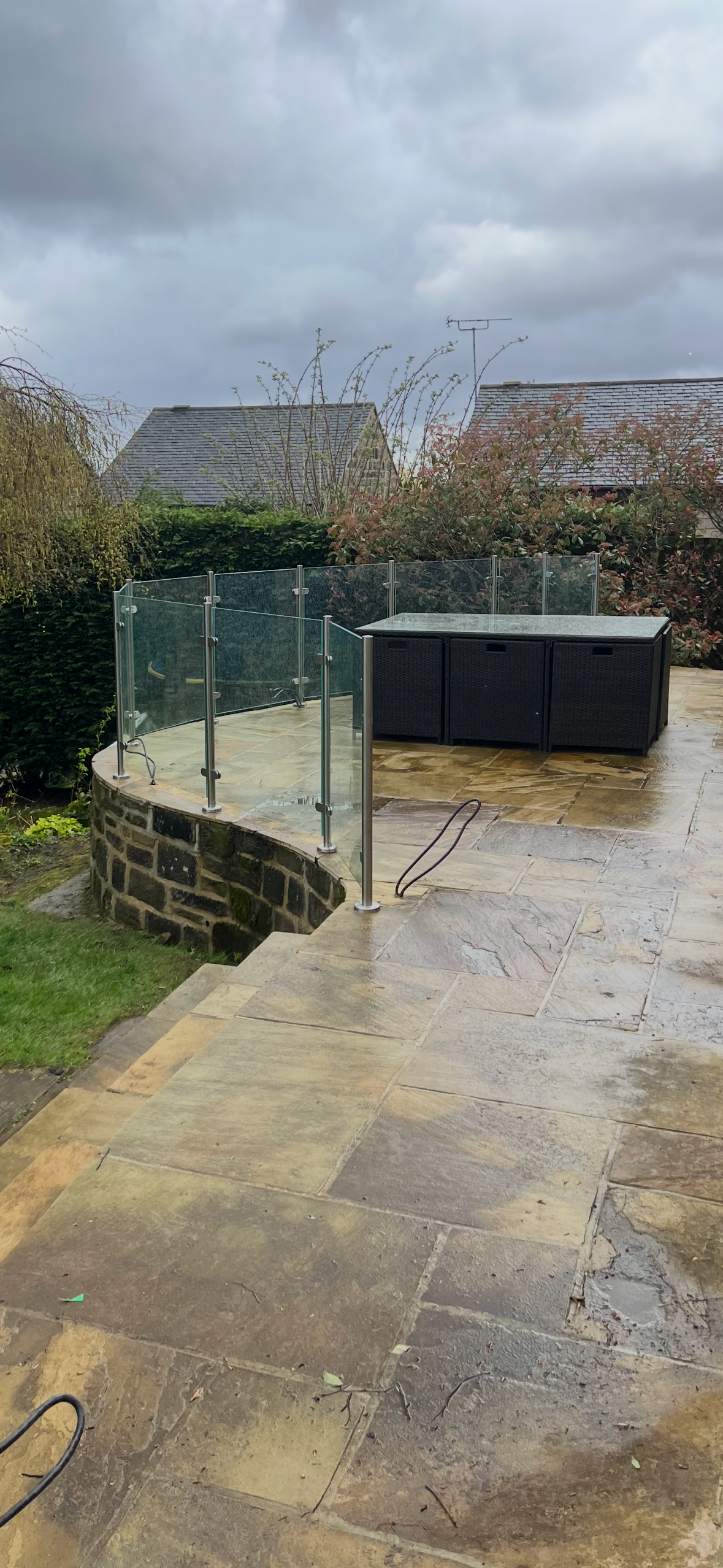 Close view of stainless steel post and glass balustrade system